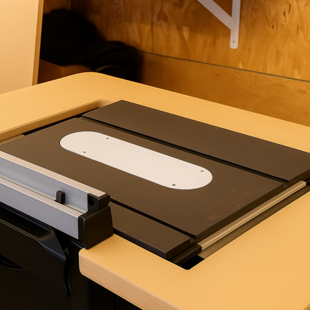 Router table insert on a wooden workbench