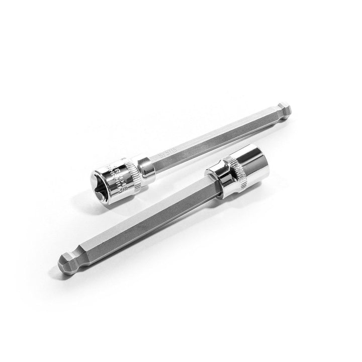 Two metallic drill bits on a white background