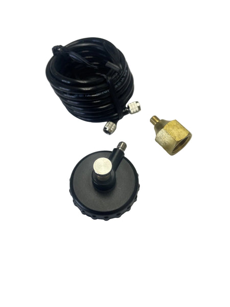 A coiled black cable with metal connectors and a round black magnetic base with a brass fitting, photographed on a plain light gray background.