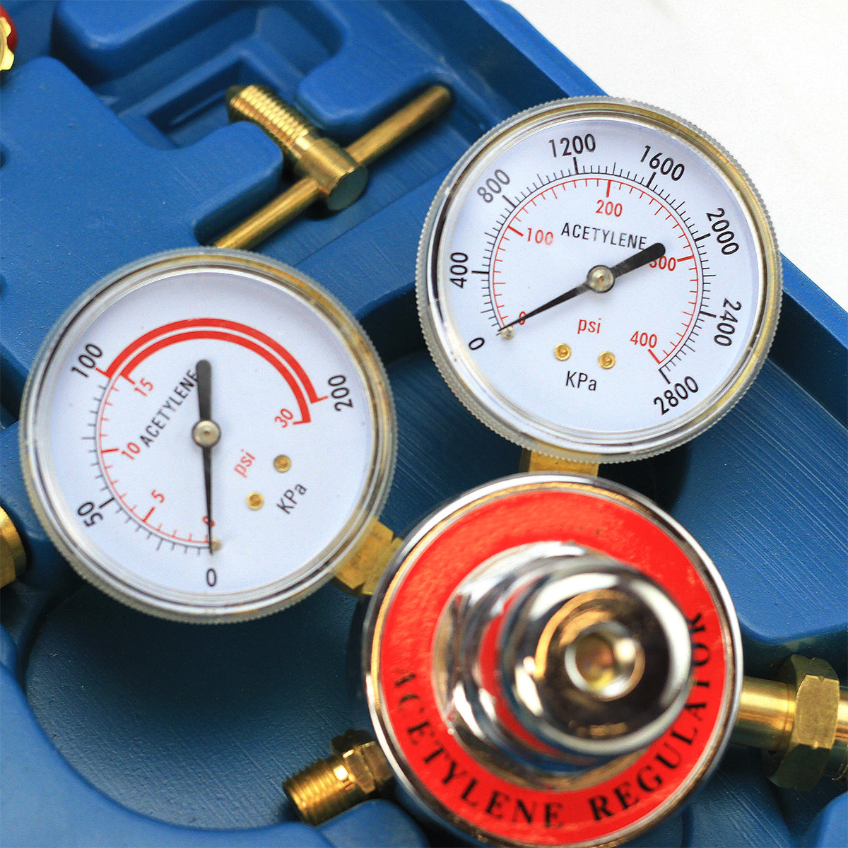 Acetylene regulator with two pressure gauges on a blue background