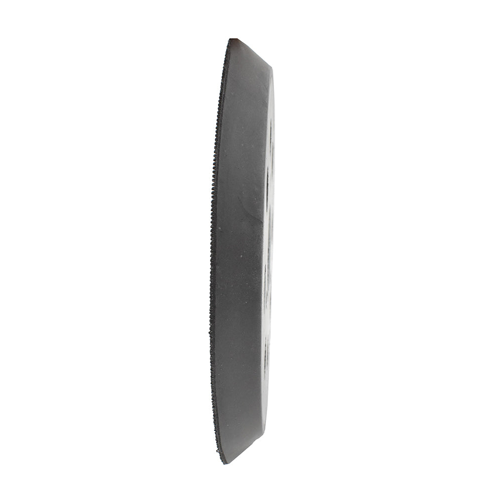 Black rectangular object with textured surface on a white background