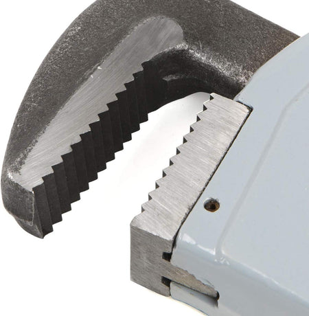 Close-up of a pipe wrench gripping a metal pipe on a white background