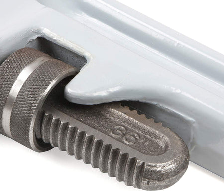 Close-up of a metal tool with a textured grip and visible brand name.
