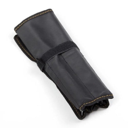 A black leather or faux-leather roll-up strap or pouch with tan contrast stitching and a black velcro strap, shown on a white background. An AK Electronics logo is visible in the bottom-left corner.