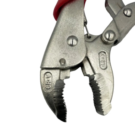 A close-up of a metal locking pliers tool with silver-toned jaws and a red handle grip, photographed against a plain light background.