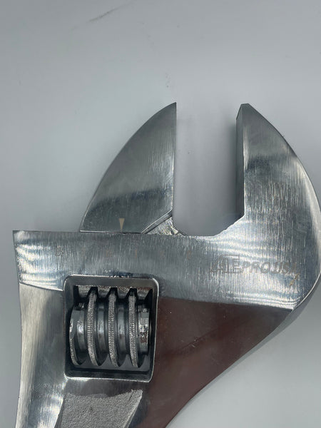 Close-up of a adjustable wrench on a white background