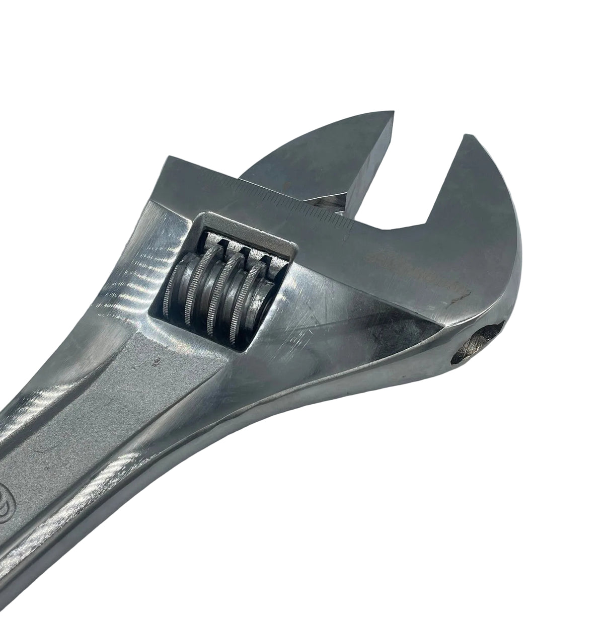 Metal adjustable wrench on a light gray background