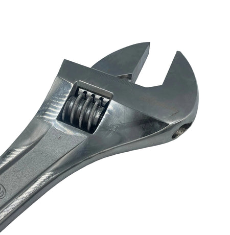 Metal adjustable wrench on a light gray background