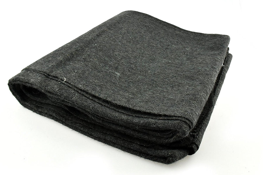 Folded dark gray blanket on a white background