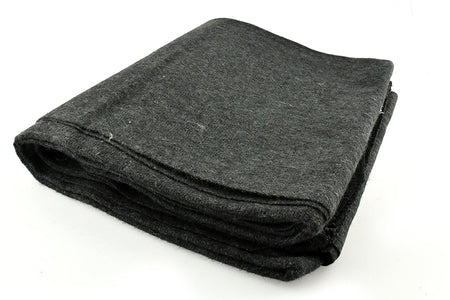 Folded dark gray blanket on a white background