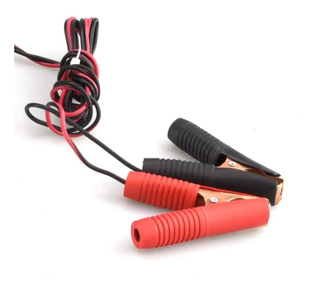 Red and black battery clamps with attached wires, shown on a plain white background.