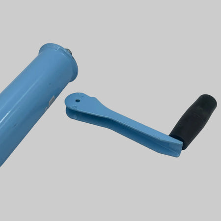 Blue cylindrical object with a black handle on a white background