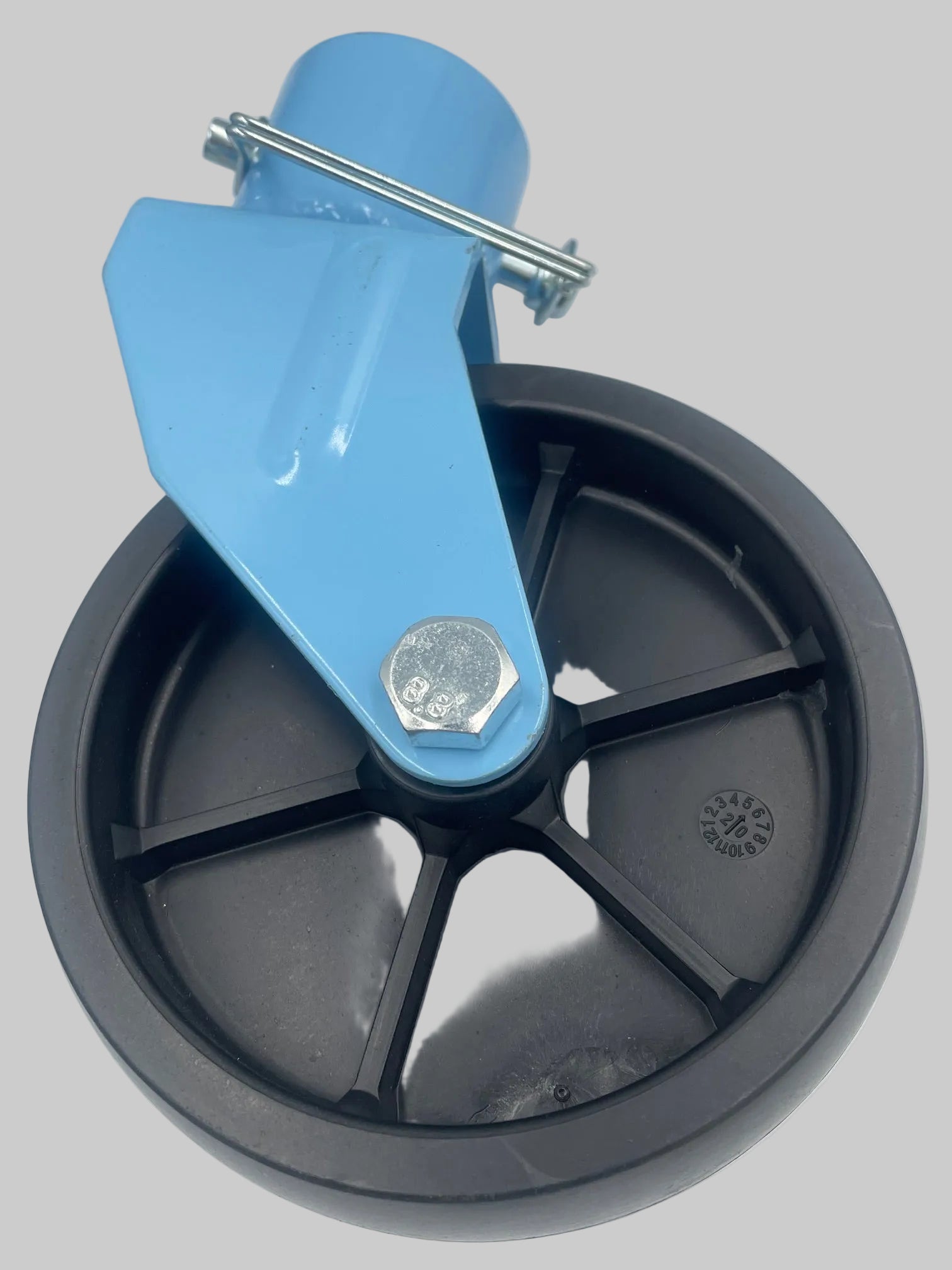 Close-up of a wheel with blue brake lever on a white background