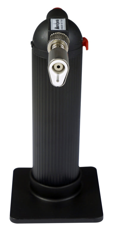 Black cylindrical device with various ports on a white background