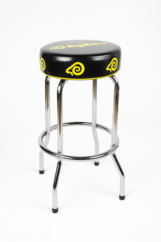 A bar stool with a black vinyl seat cushion featuring yellow spiral graphics and the 'BigTime' logo, supported by a chrome metal tubular frame on a white background.
