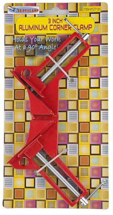 Red 3-inch aluminum corner clamp on a colorful packaging background