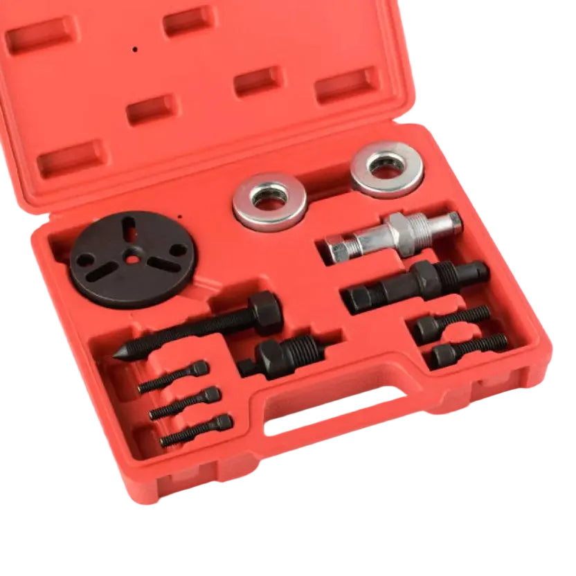 A red plastic tool case opened to show a set of metal and black tool accessories, including wrenches, sockets, and circular metal pieces, photographed on a white background.