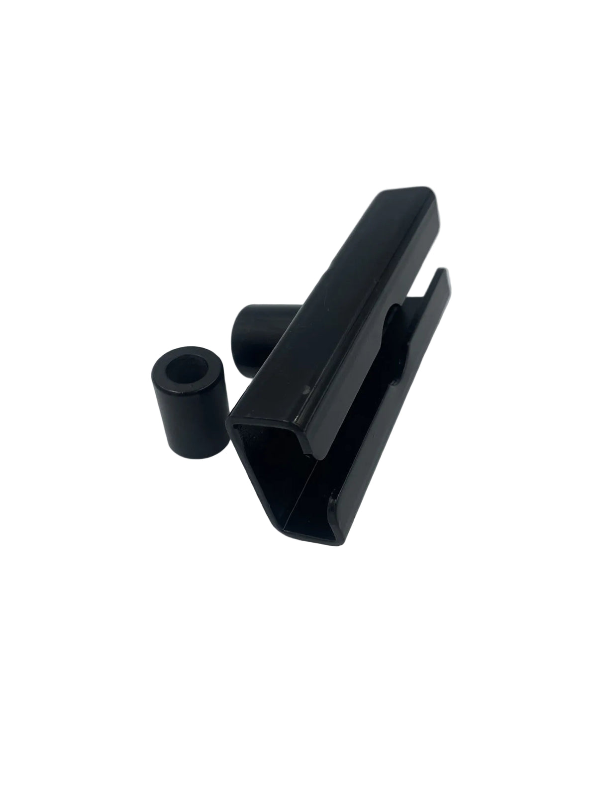 A black plastic mounting bracket with two cylindrical black components, photographed on a plain light gray background.
