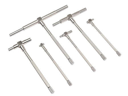 Six silver metal T-handle wrenches in different sizes arranged on a plain white background.