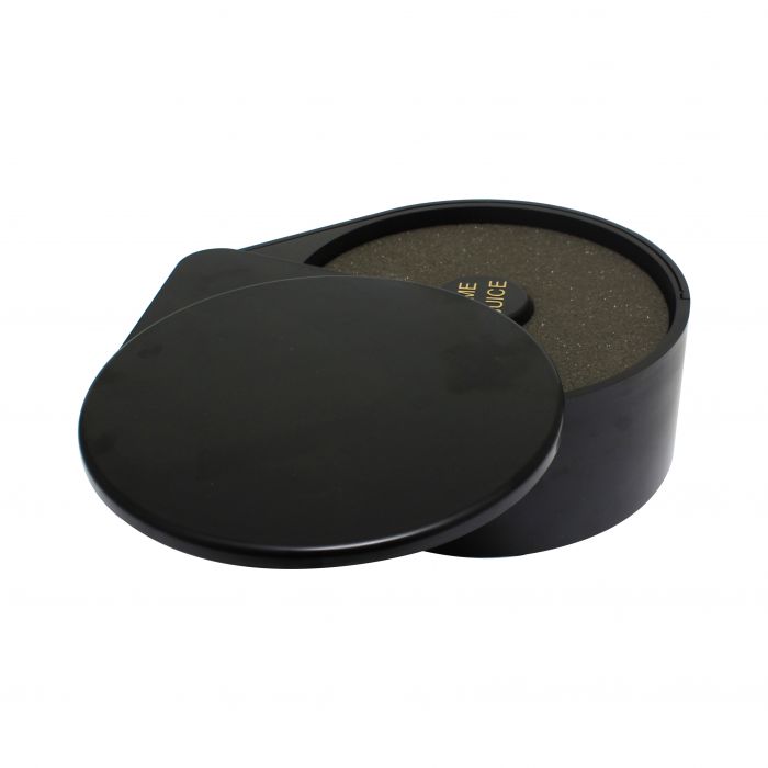 Black round container with a lid on a white background