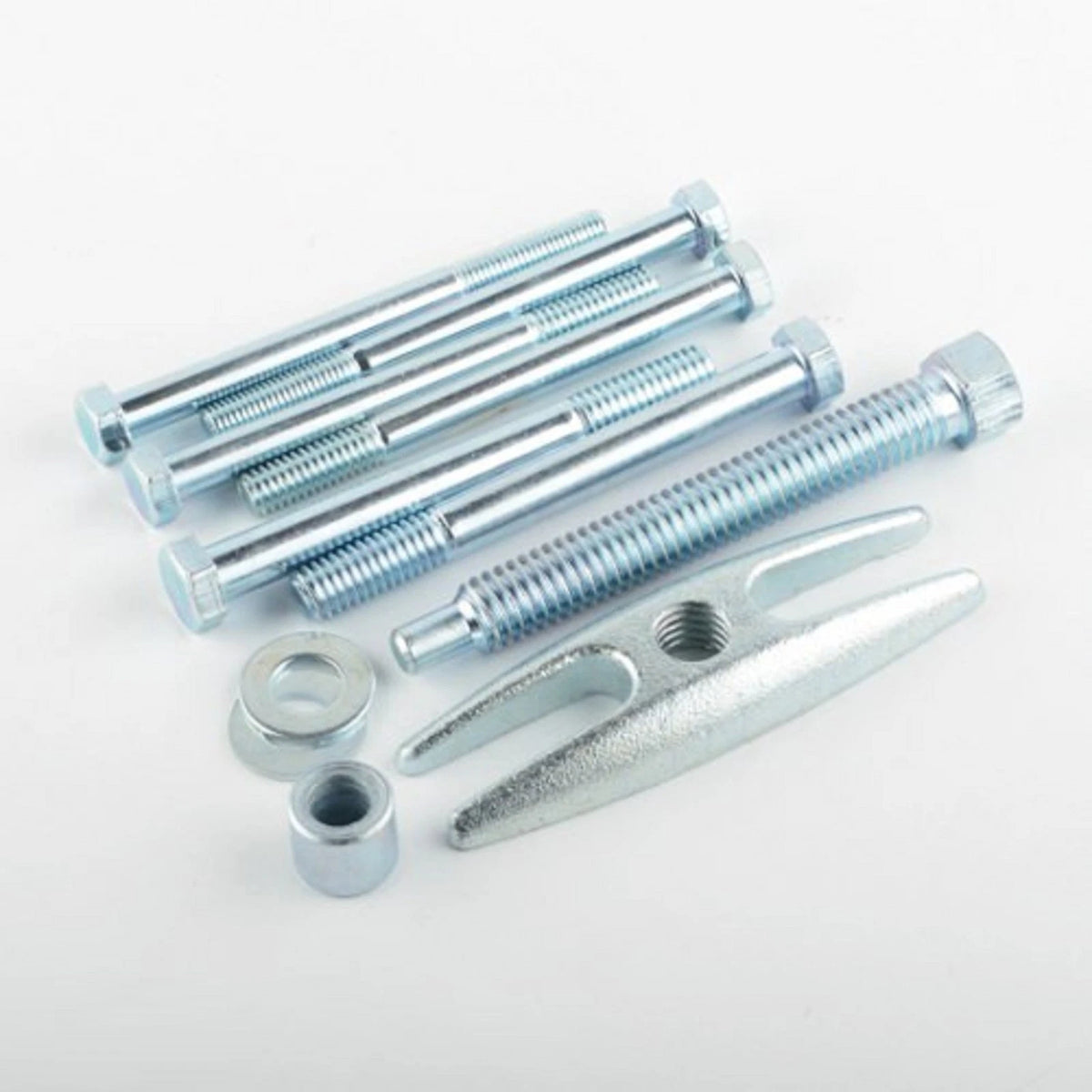 Set of metal bolts and tools on a white background