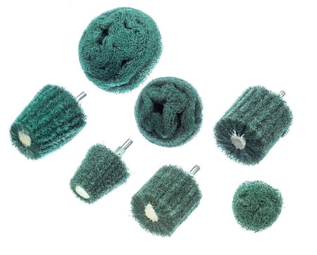 Set of green abrasive buffs on a white background