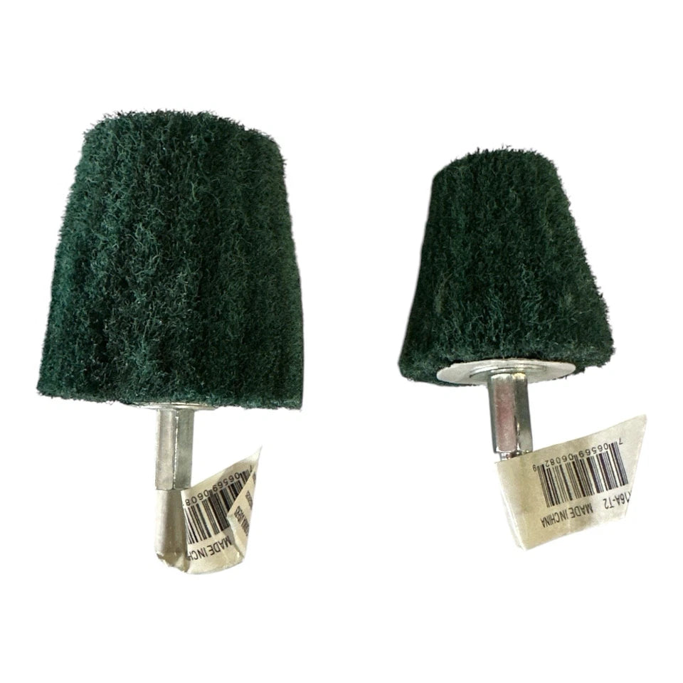 Two green abrasive wheels with metal bases on a white background