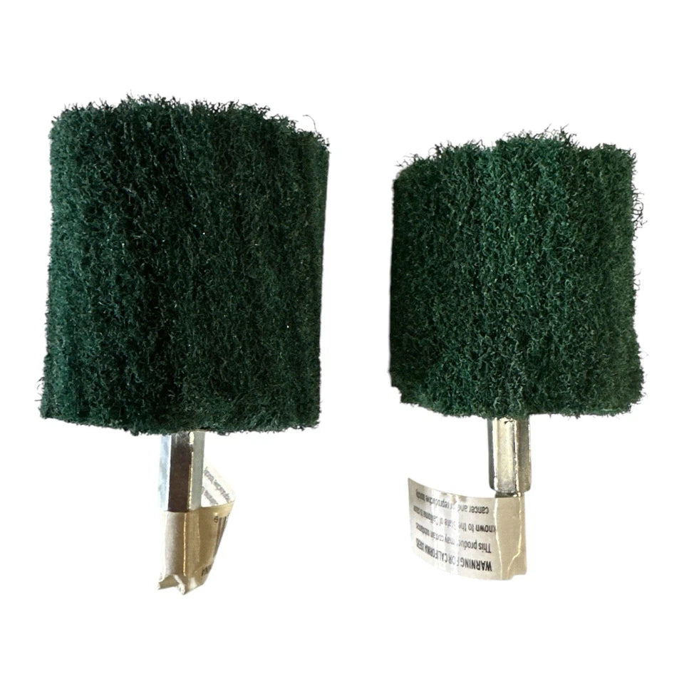 Two green scrubber pads on white background