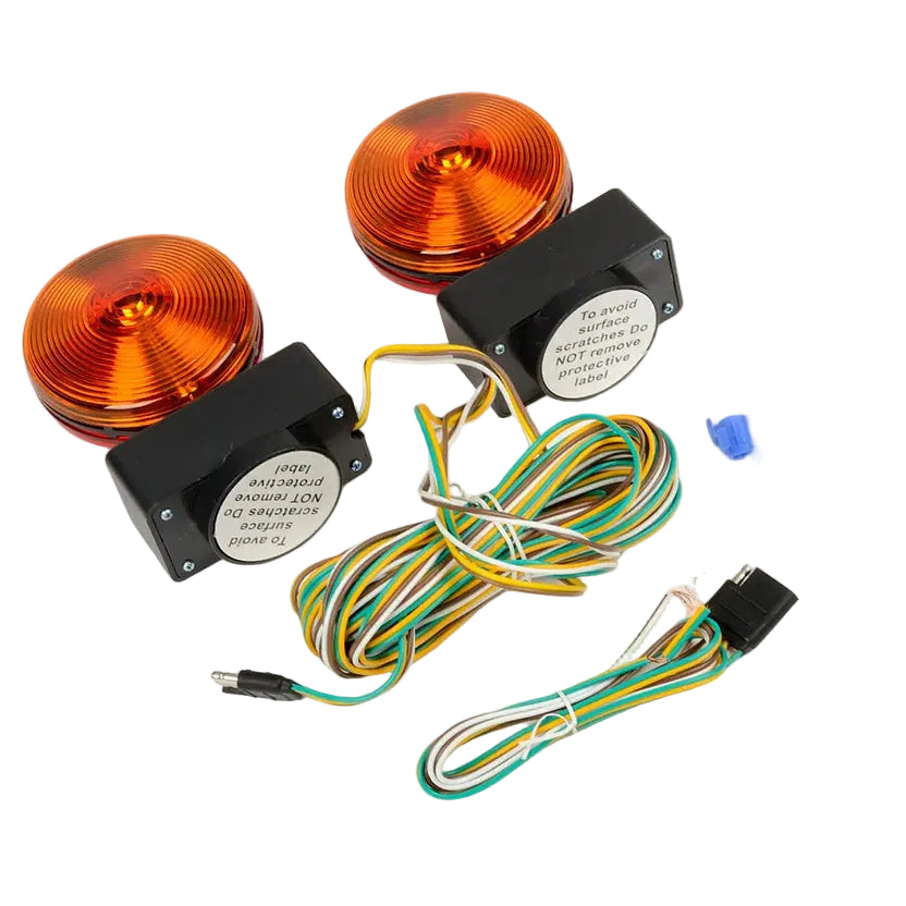 A pair of orange circular vehicle marker lights with black housings, shown with wiring harnesses, blue connector plugs, and a small clear bag of accessories on a white background. An AK Electronics logo is visible in the bottom-left corner.